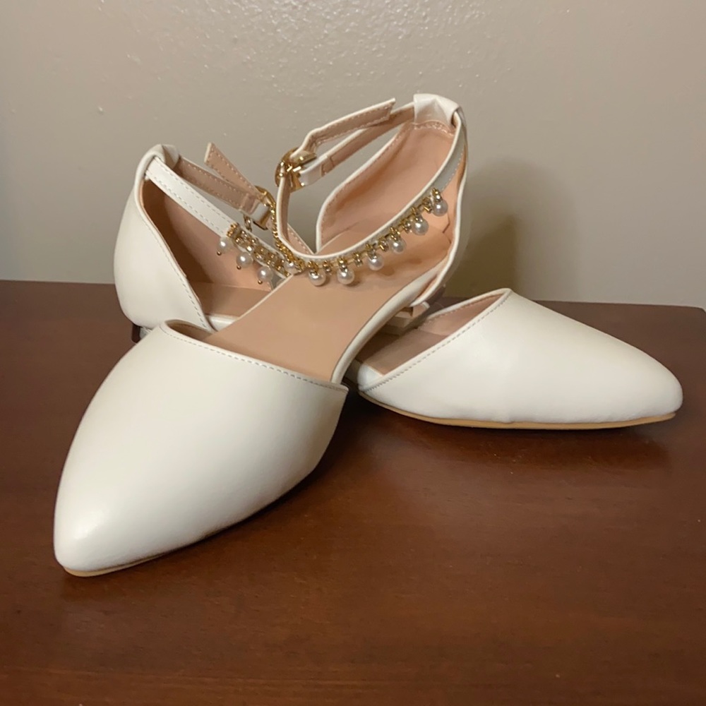 Never worn, white flat shoe.